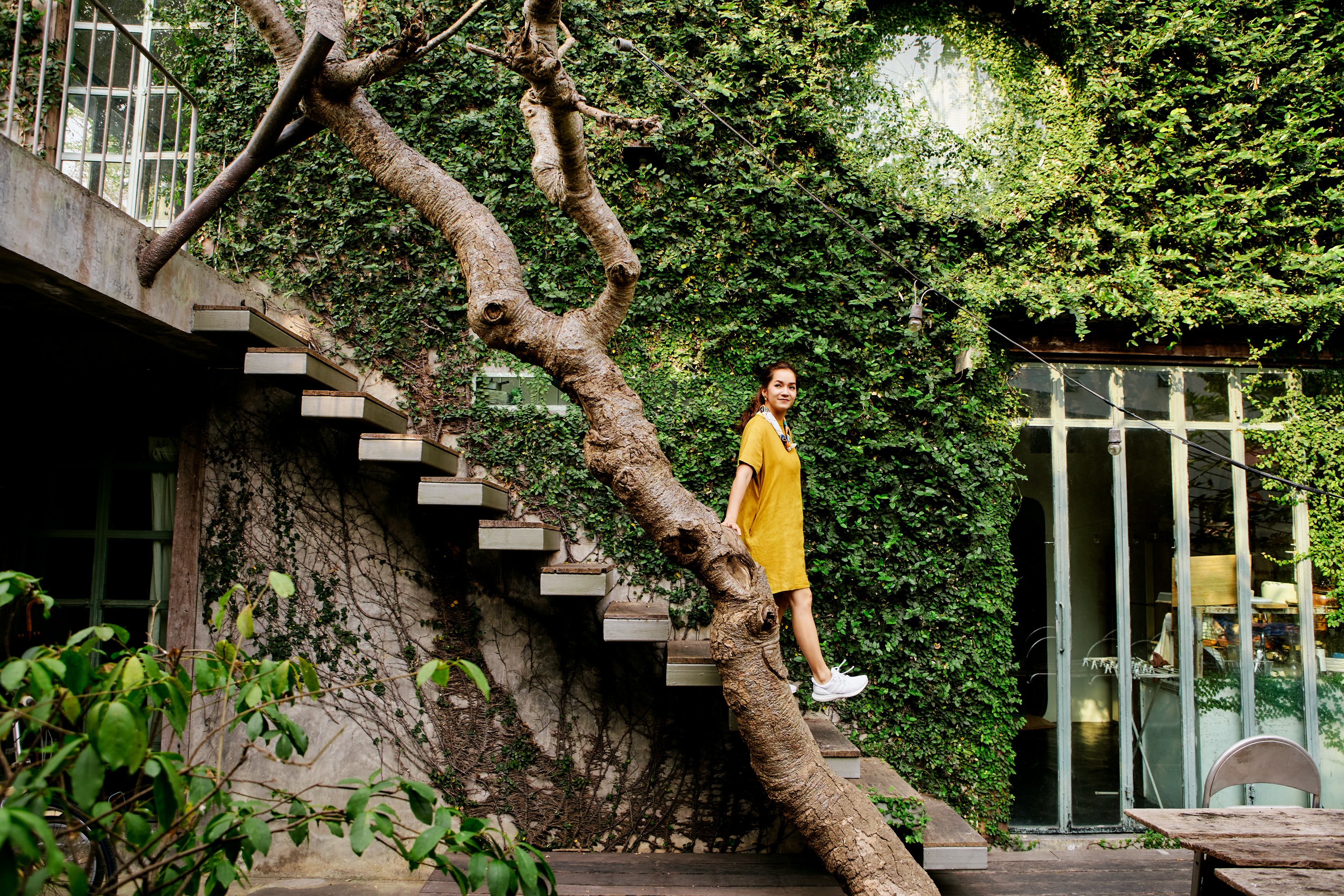 An Airbnb host walking down an outdoor staircase.