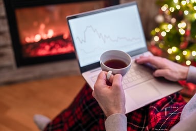 holiday person with laptop stock market