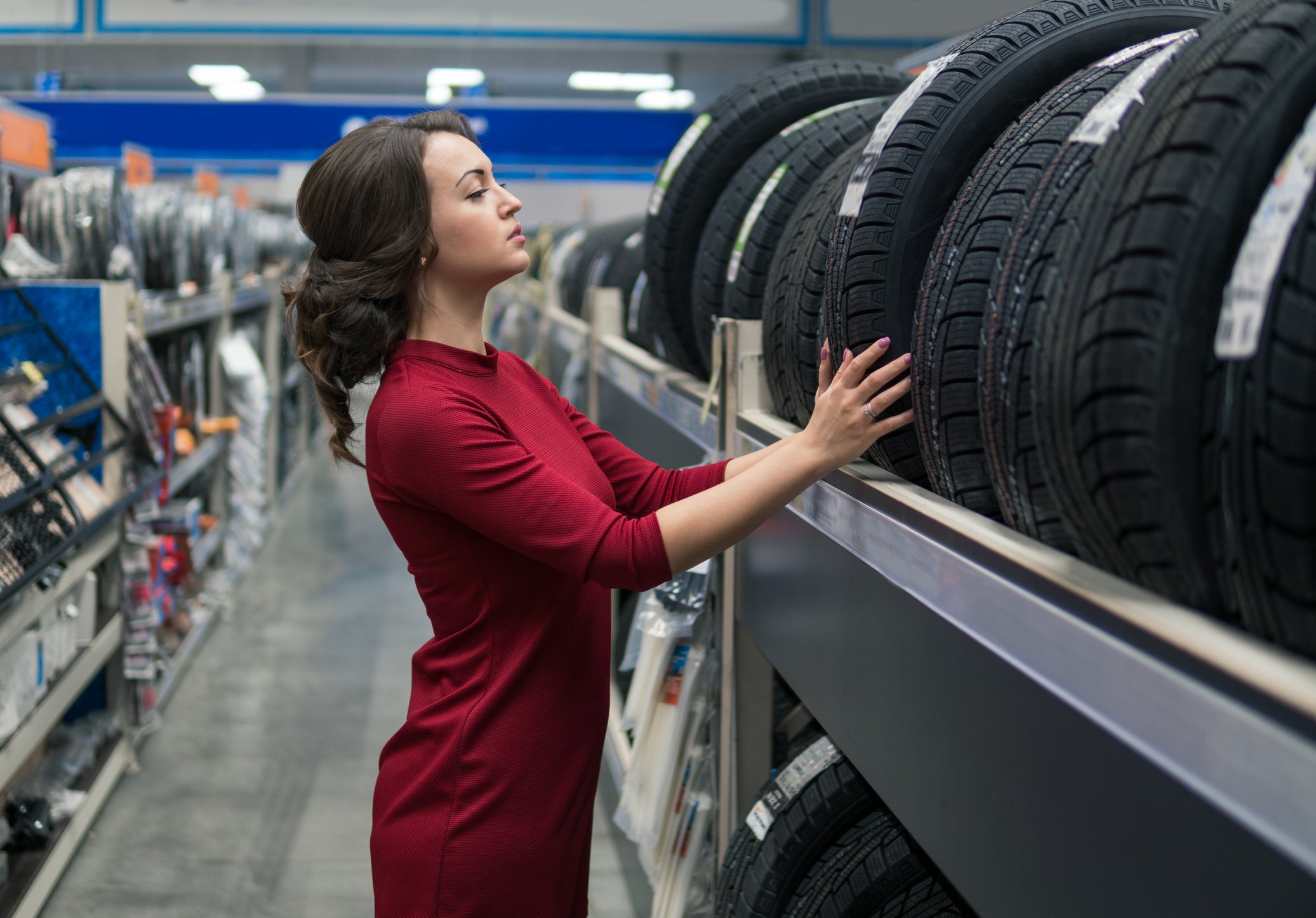 A customer shops for new car tires.