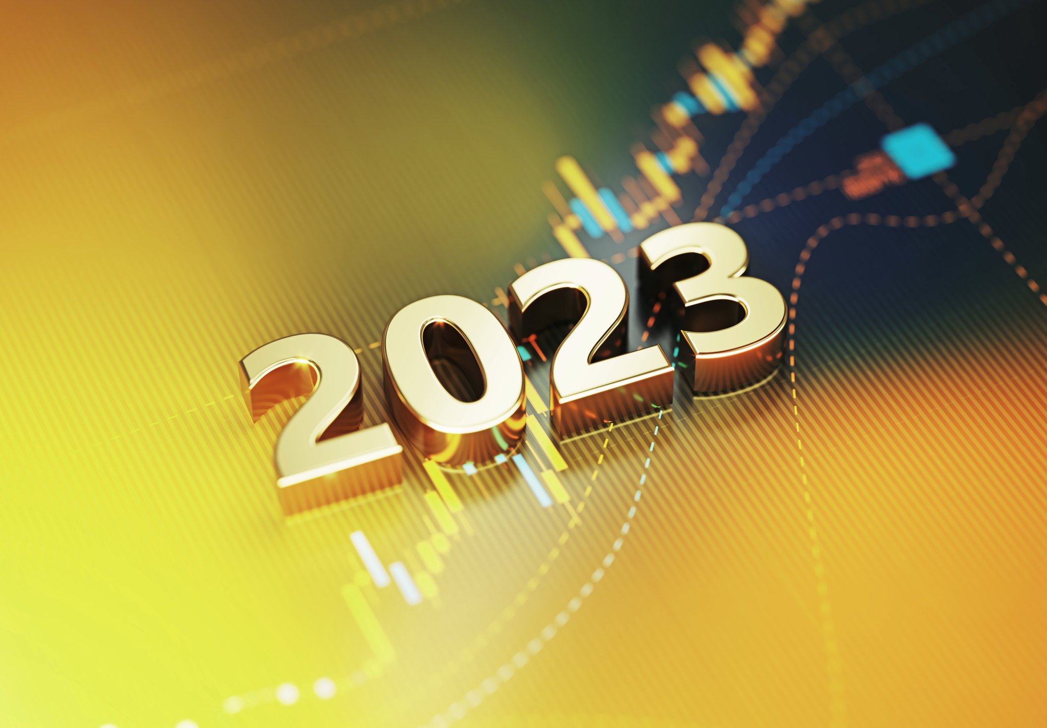 2023 sitting on yellow financial graph background.