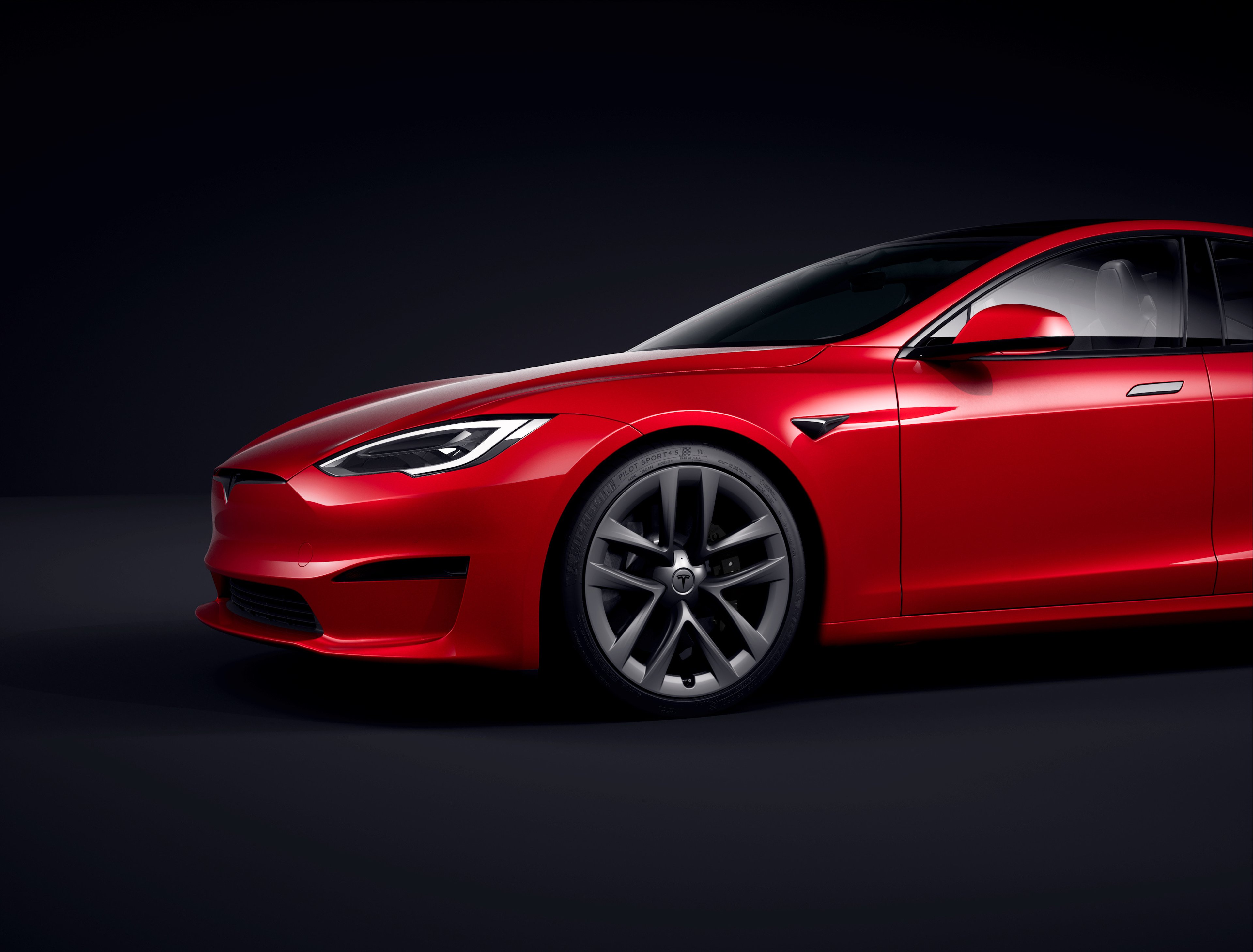 front end of red Tesla Model S. 