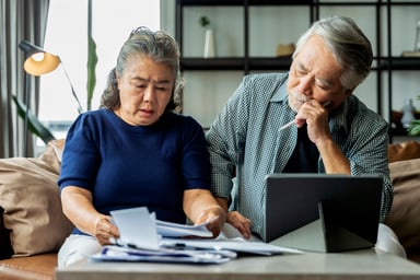 Older Asian couple stressed