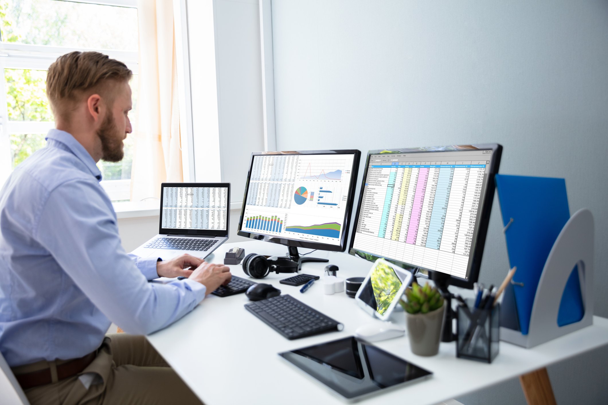 A businessperson works with spreadsheets
