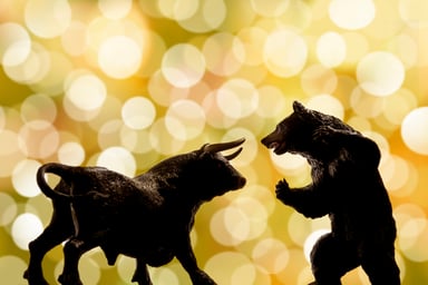 A bull facing a bear.