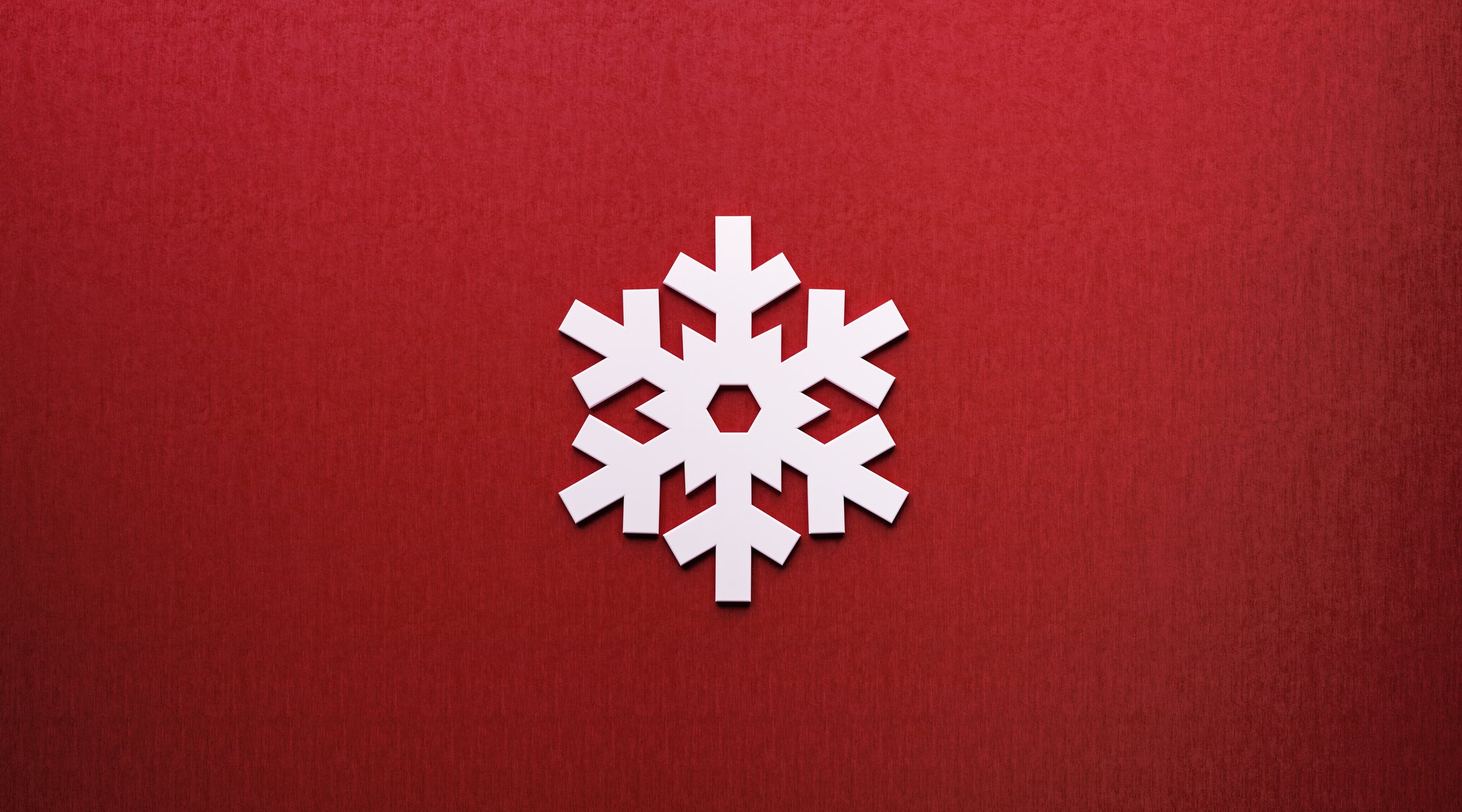 A snowflake on a red background.