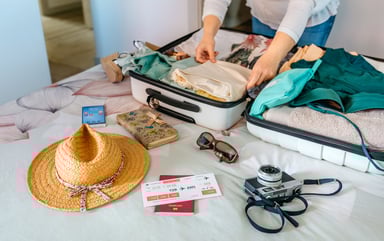 packing suitcase for vacation holiday tourist