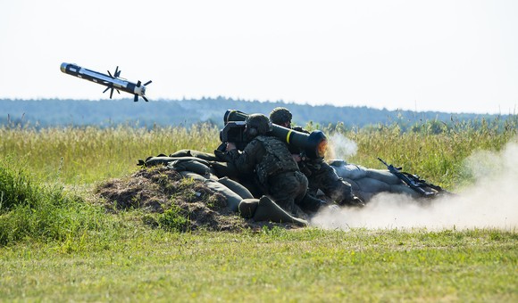 Soldiers launching Javelin missile.