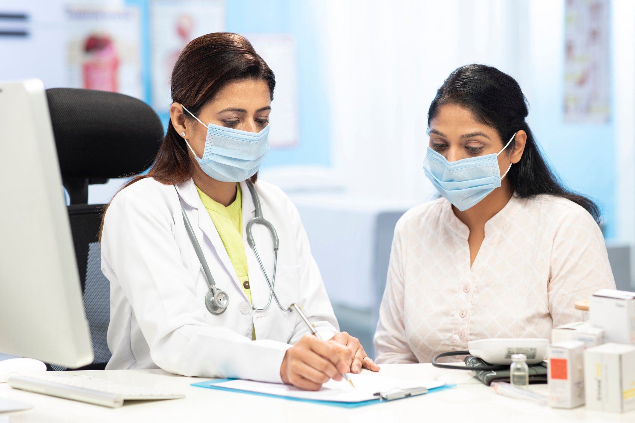A patient meets with their doctor for a consult.