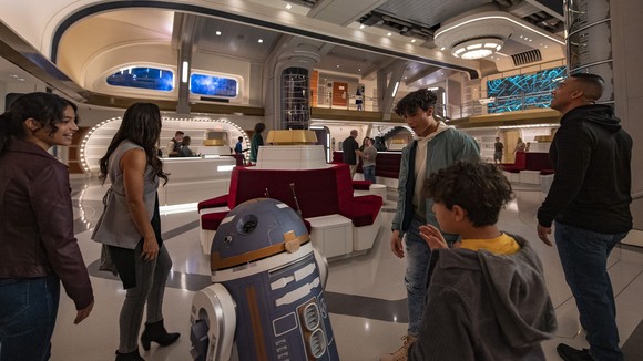 A family boarding the Star Wars: Galactic Starcruiser experience.
