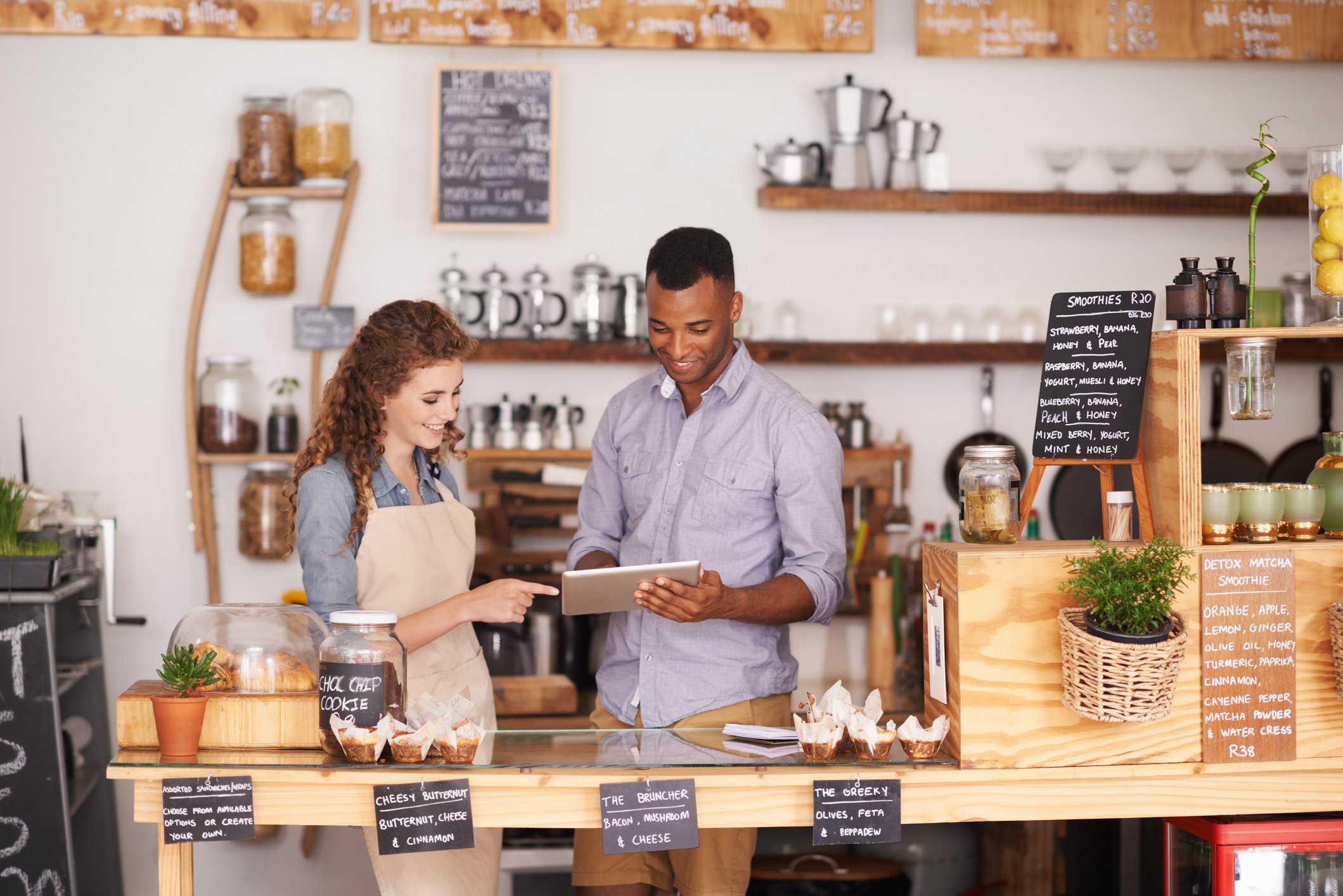 A man and a woman working at a restaurant.