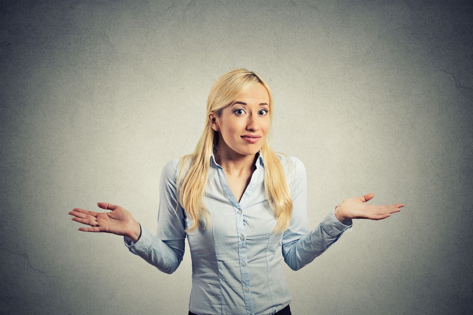 woman shrugging confused uncertain