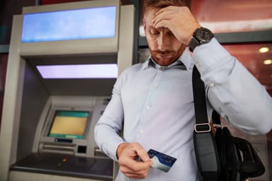 Person upset at ATM Getty