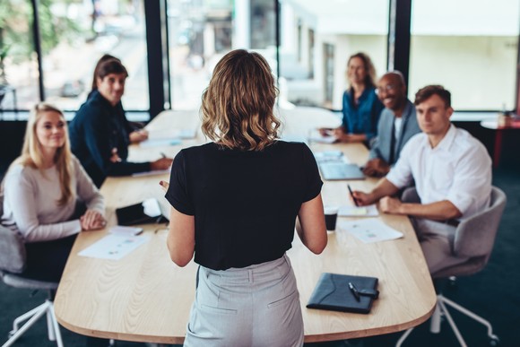 People sitting in a board room.