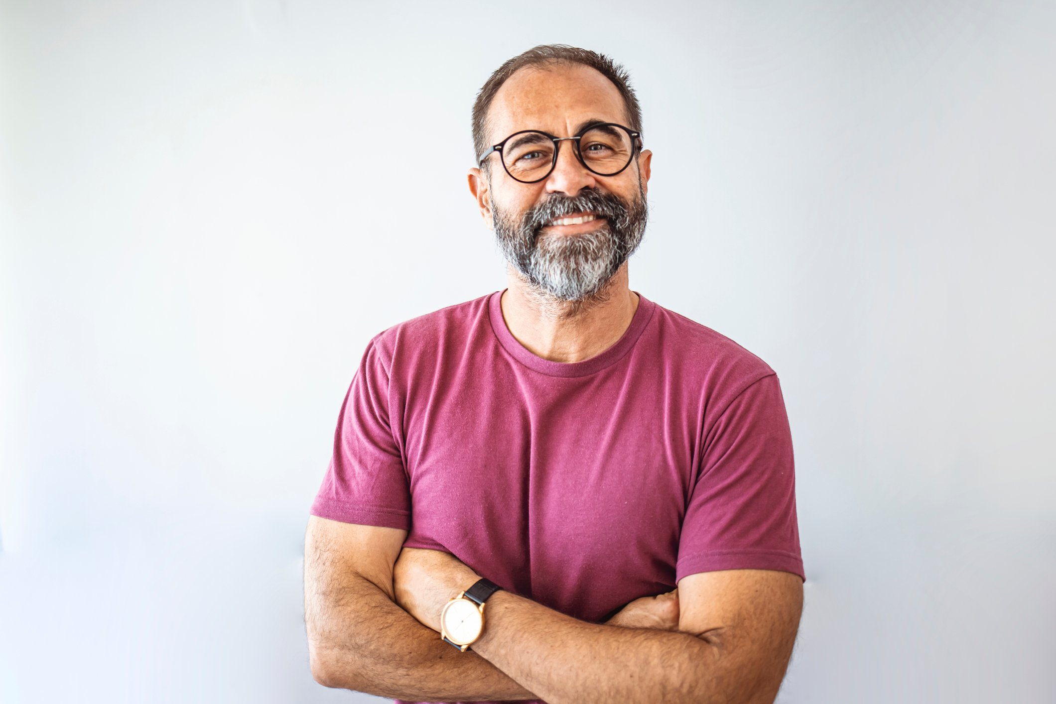 smiling person with arms crossed