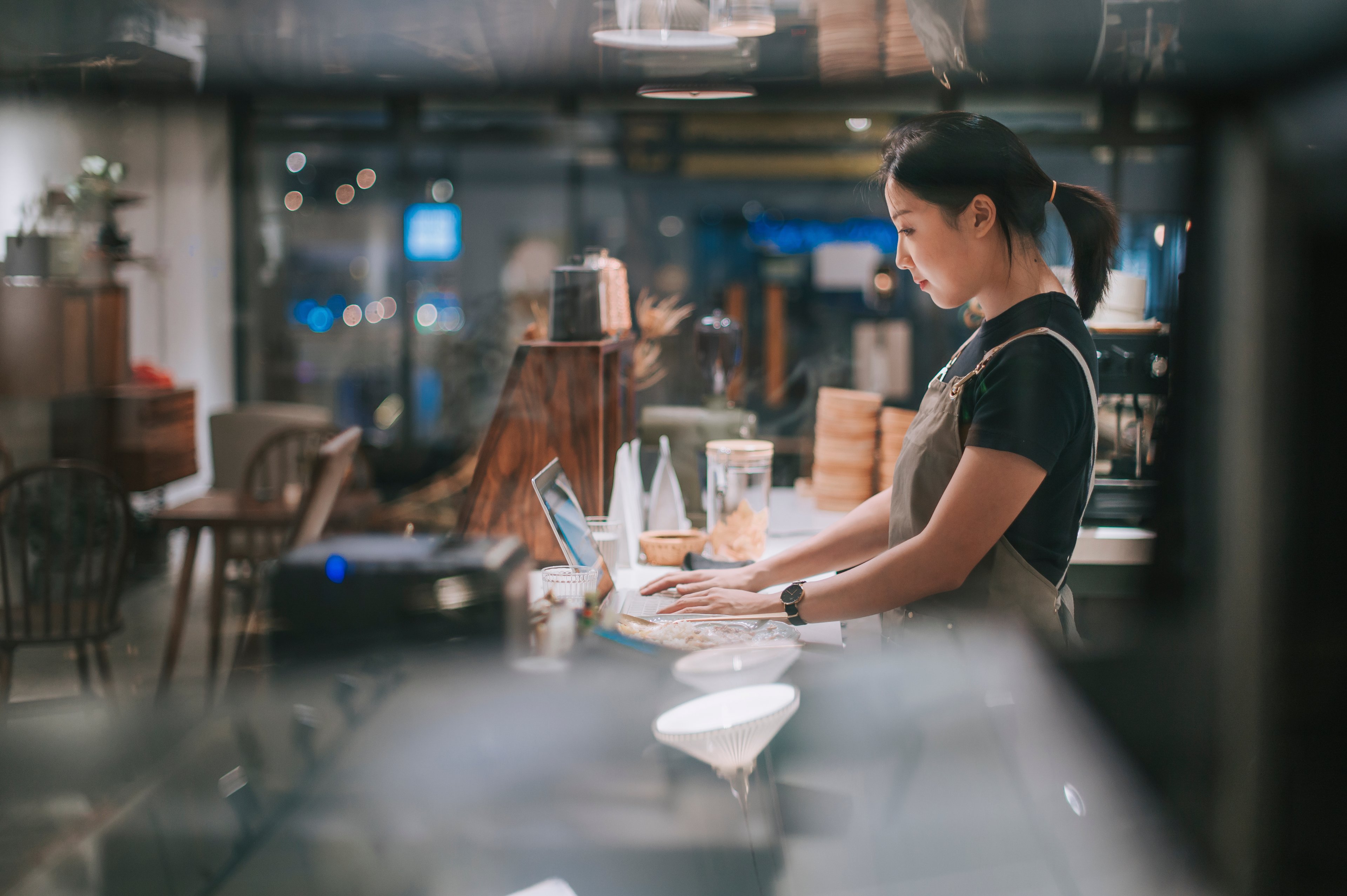 working coffee shop small business owner