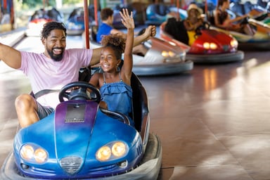 dad and daughter on bumper car ride (1)