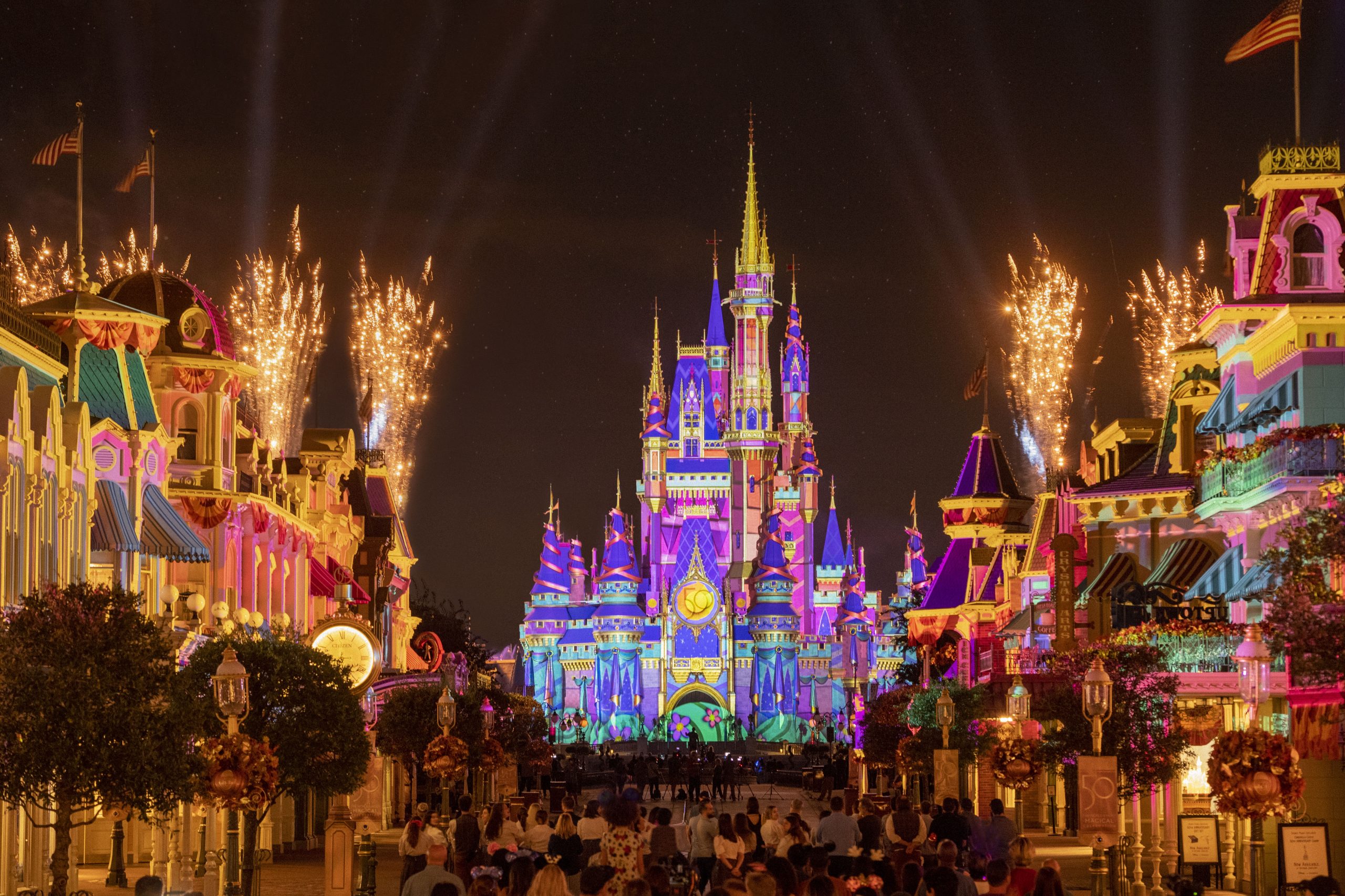 Disney's World Magic Kingdom all lit up at night.