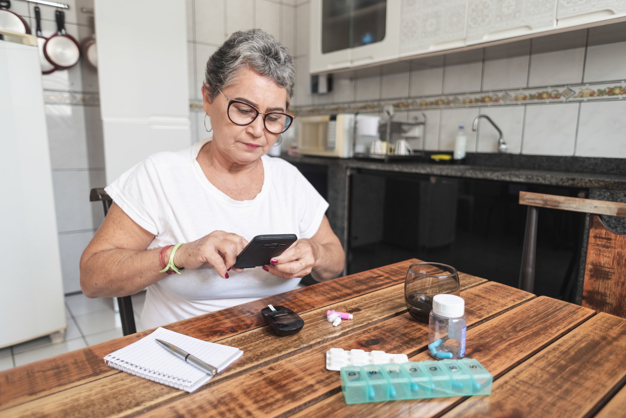 Person using blood sugar monitoring system