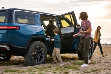 Family getting in to Rivian R1S