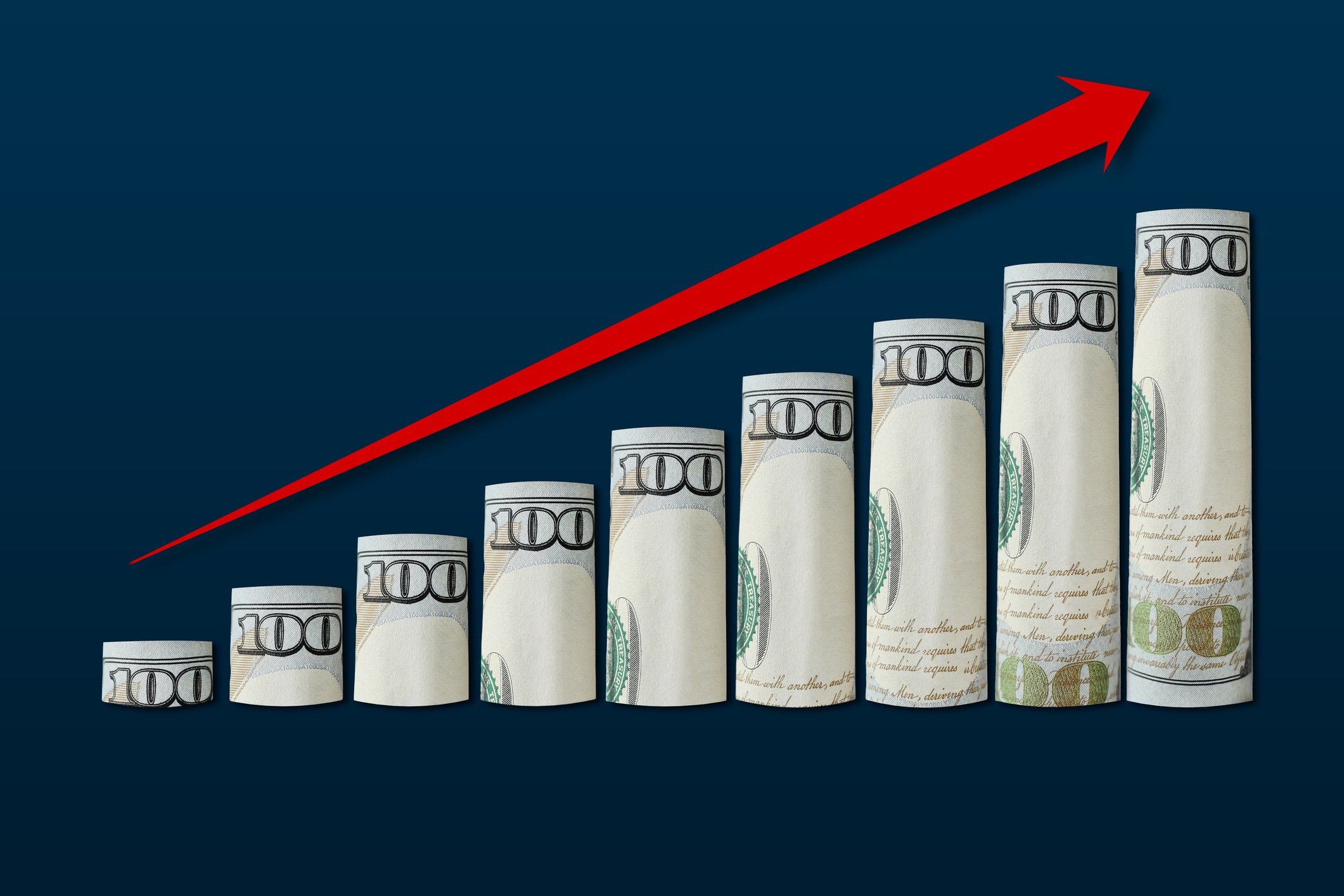 Dividend growth hundred dollar bills arrow up