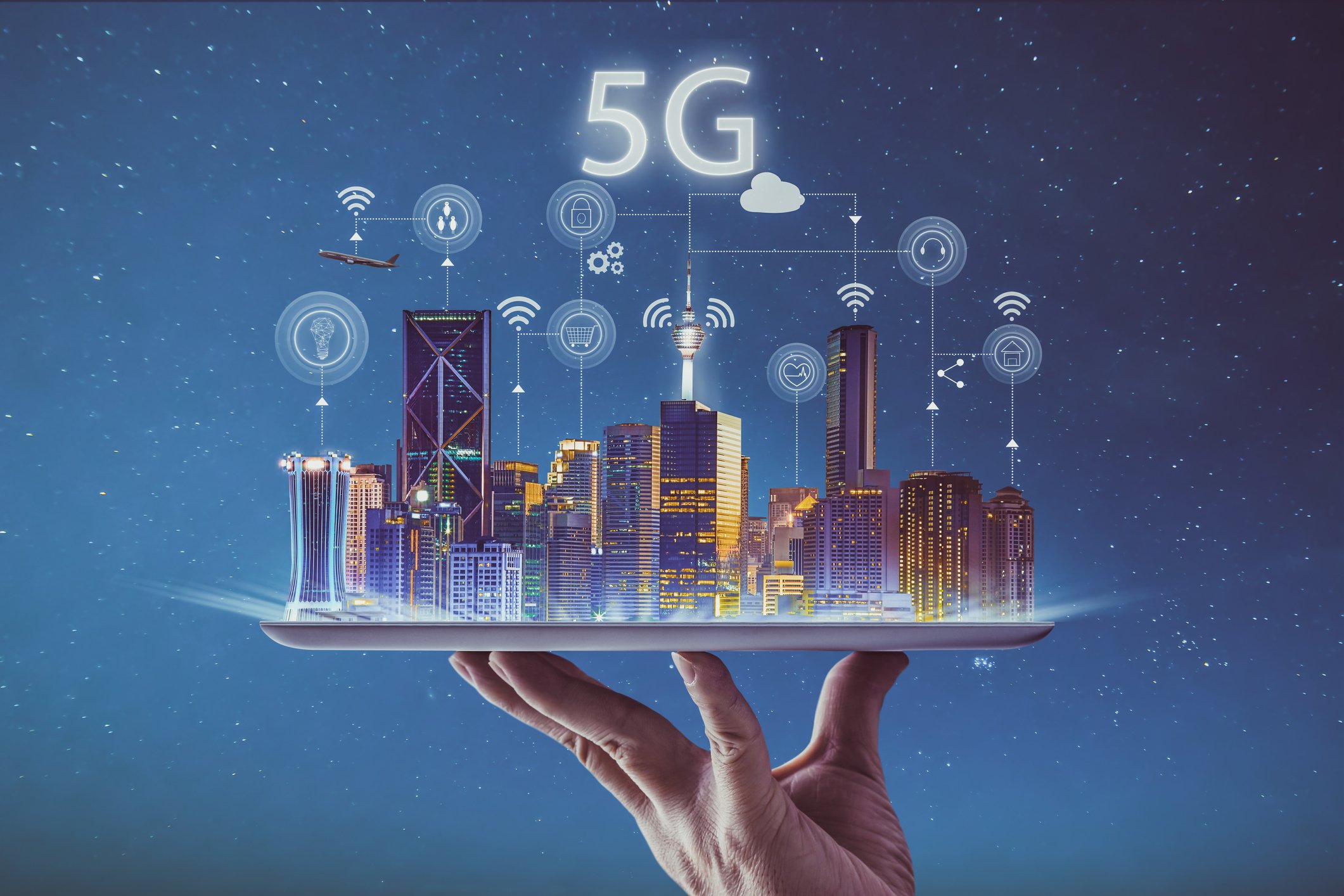 5G graphic held in a person's hand. 