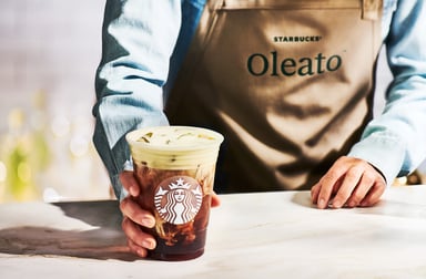 Starbucks barista with an Oleato drink