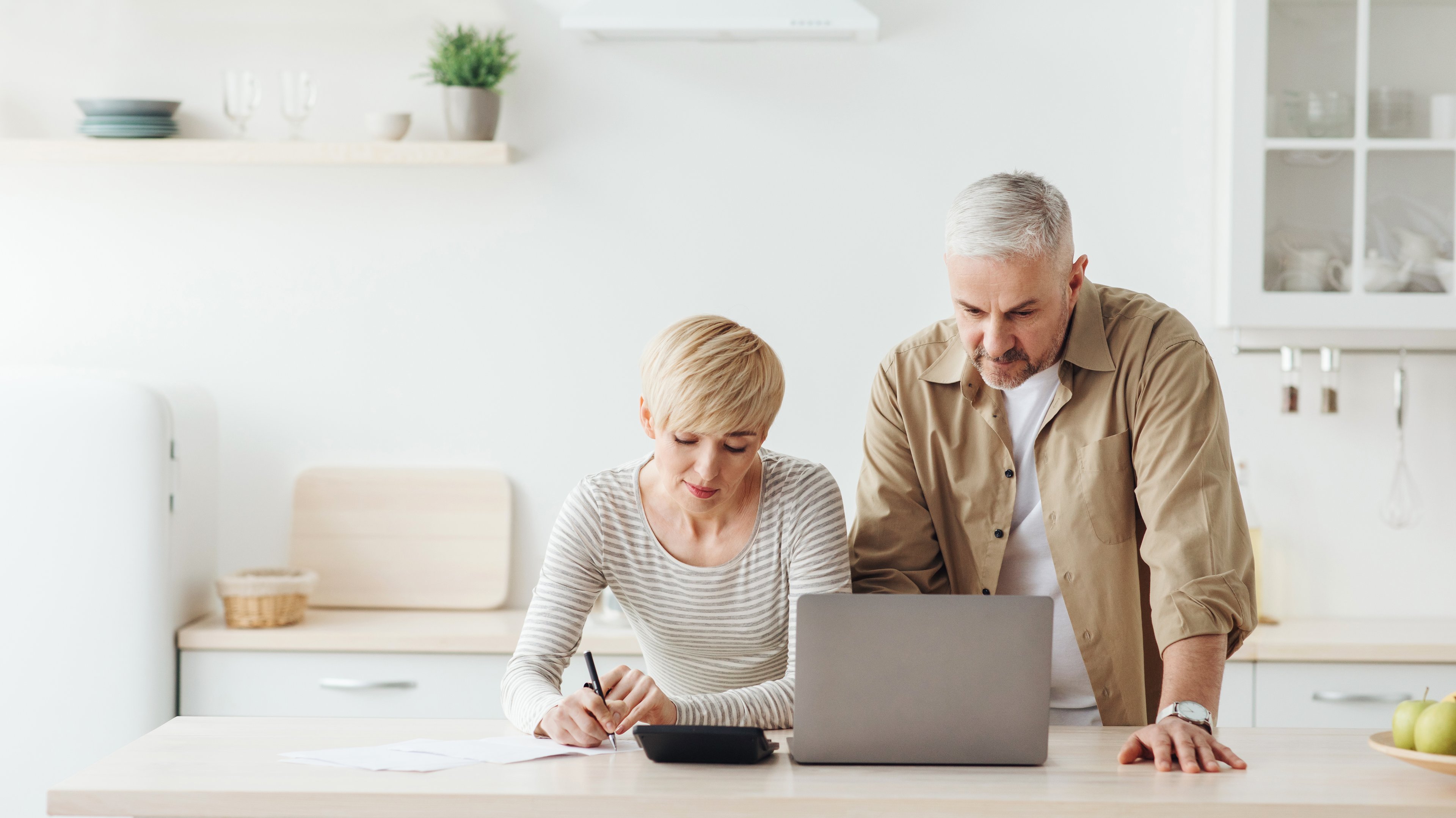 two people review finances investing portfolio