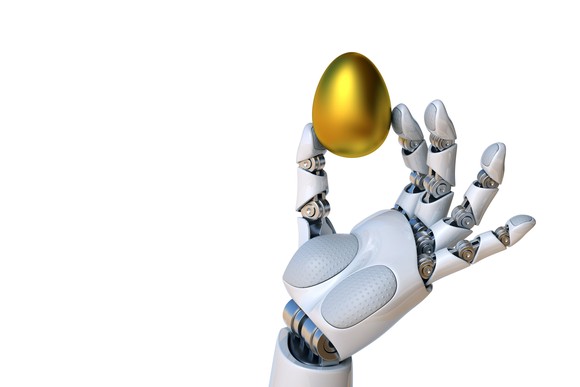 Robot hand holds a golden egg.
