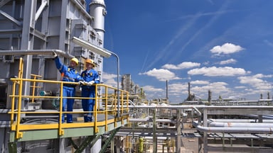 two workers oil refiner getty 2022