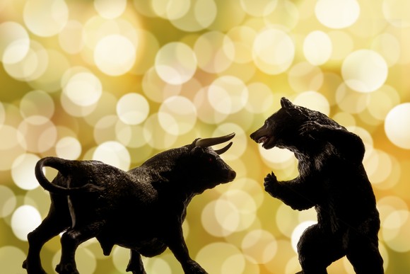 A bull facing a bear.