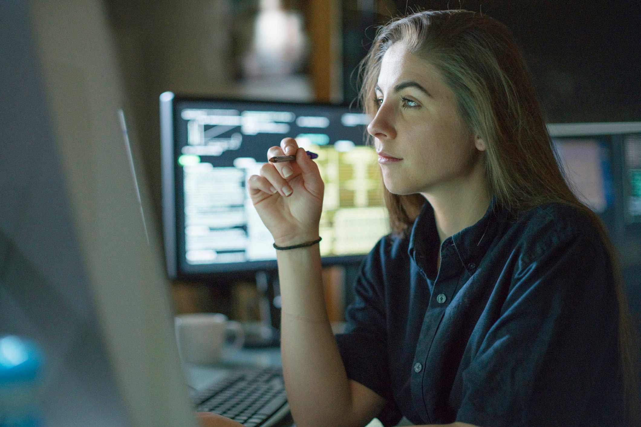 A person looking at data on a screen.