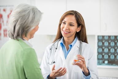 Doctor giving a patient medication.
