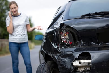 auto-insurance-car-damage-crash-owner-on-phone