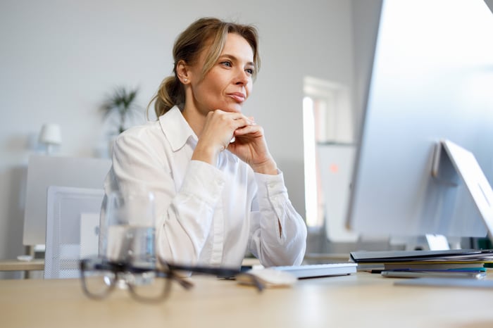 A person at a computer.