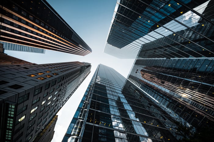 A view of skyscrapers from the ground up.