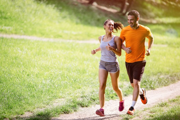 Two people jogging outdoors.