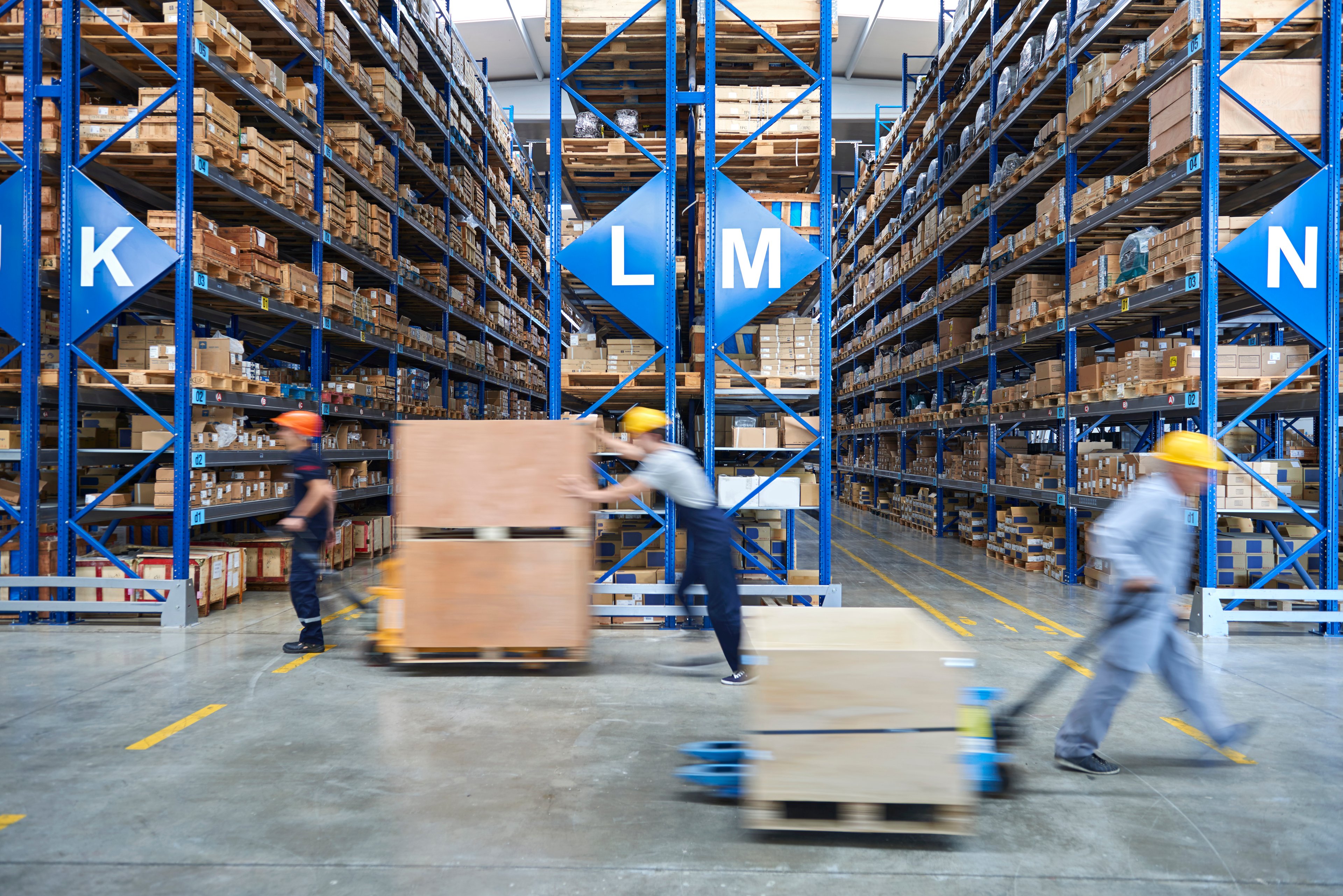 People working in a warehouse.