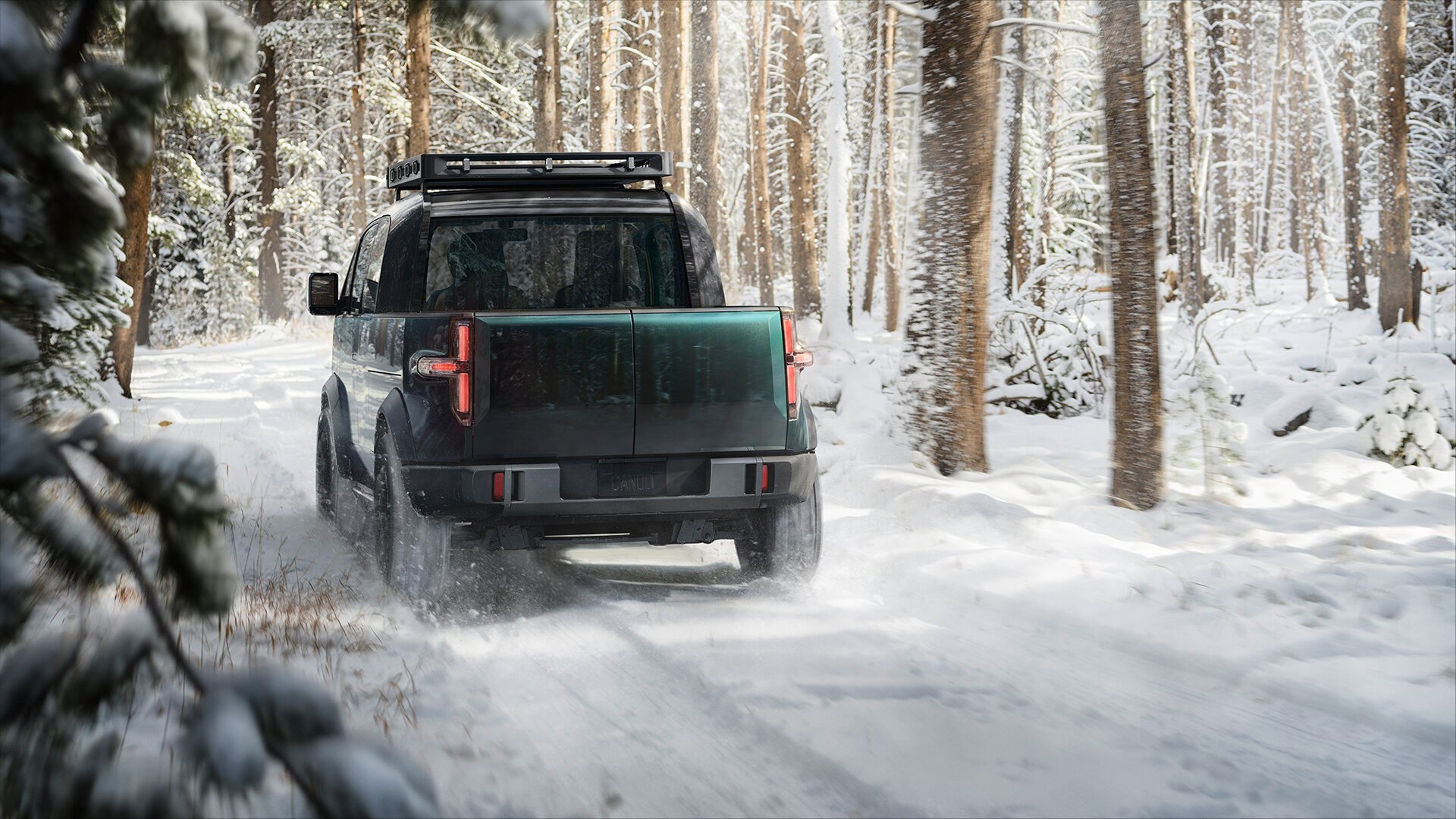 A Canoo pickup truck in the snow.