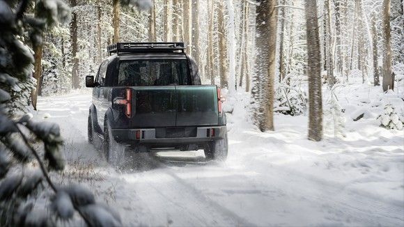 A Canoo pickup truck in the snow.