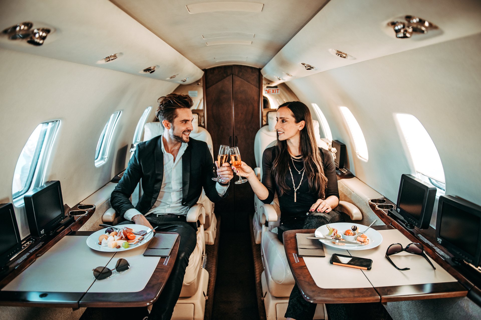 Two 20-somethings flying in a private plane.
