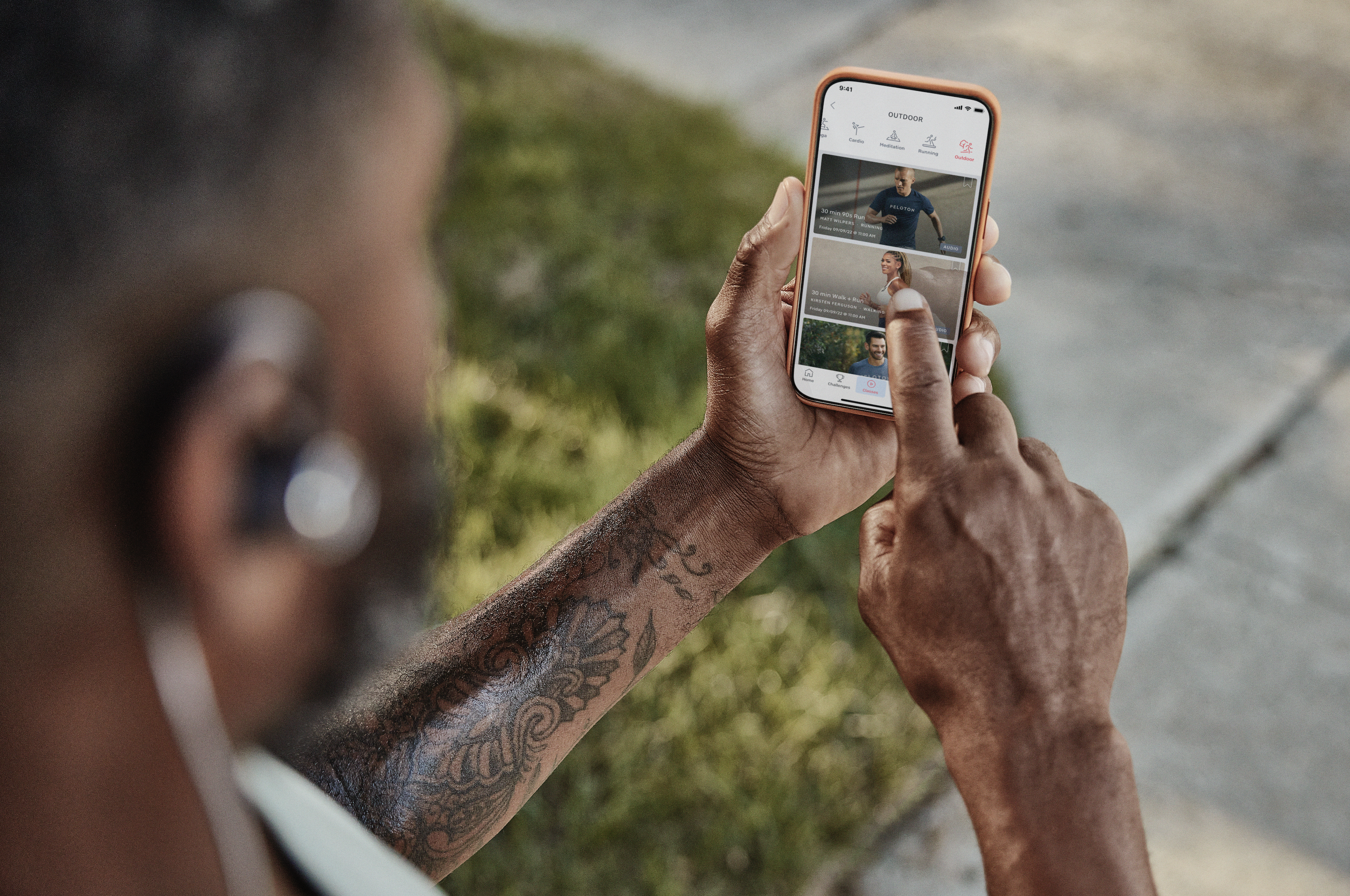 A Peloton member engaging with the app outdoors.