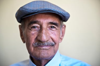 closeup of person in cap facing camera