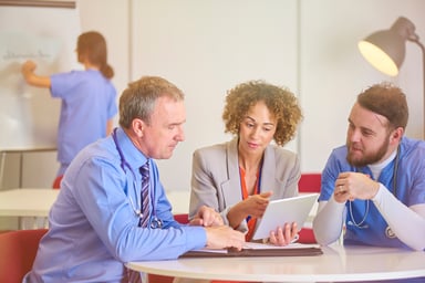 doctor and nurse talk with investor