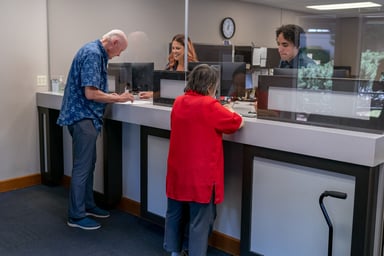Customers being served at a bank.