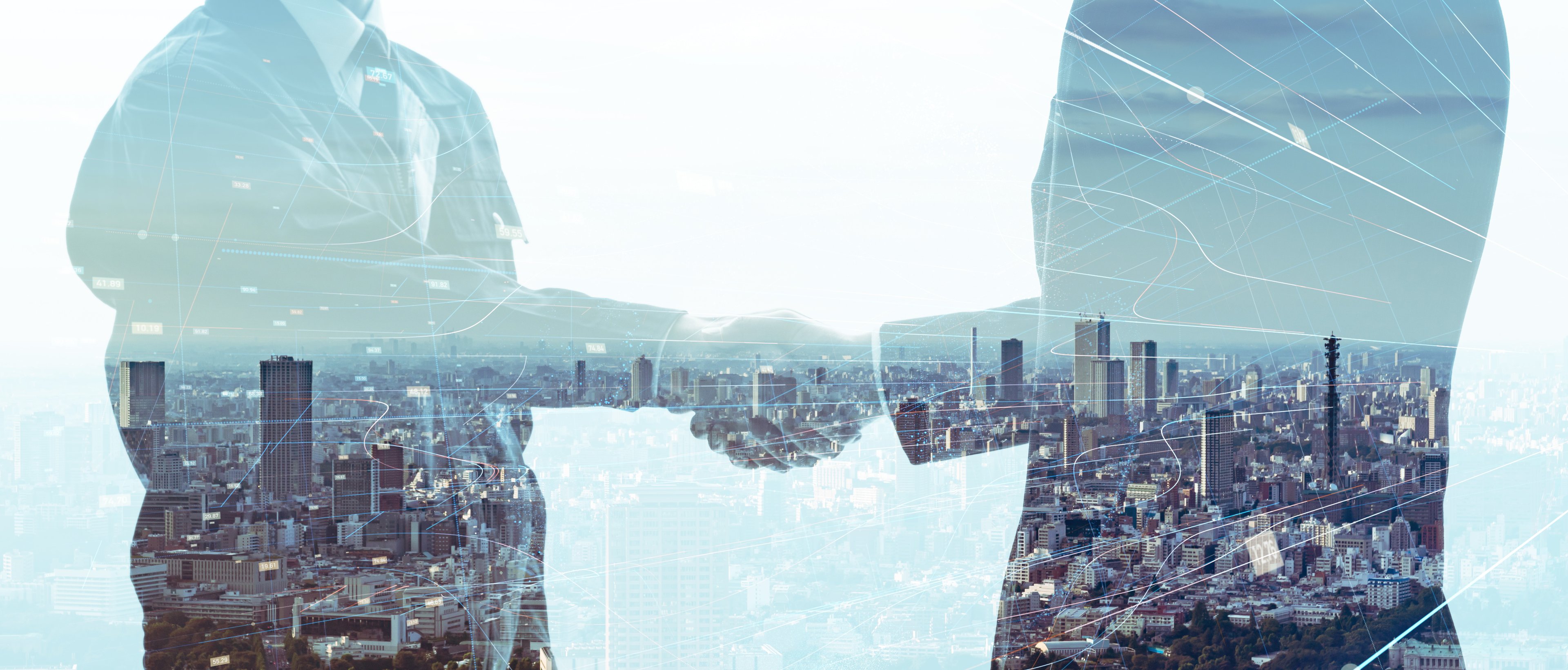 Outline of two people shaking hands superimposed over a cityscape.