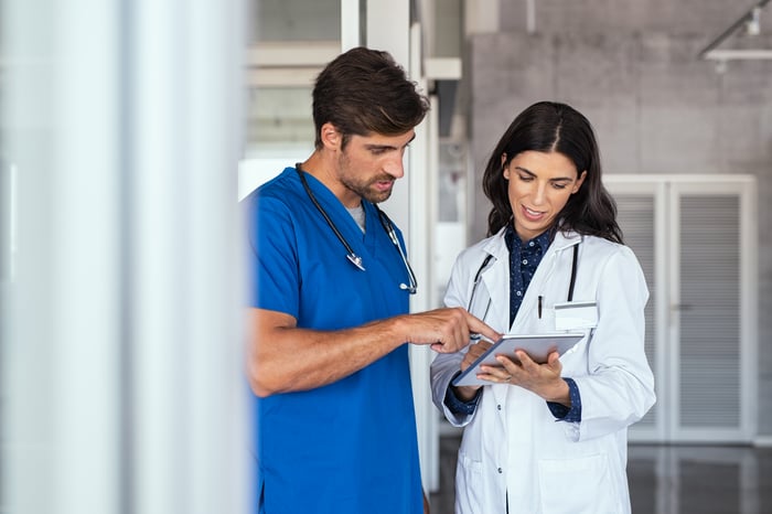 Two healthcare professionals having a conversation.