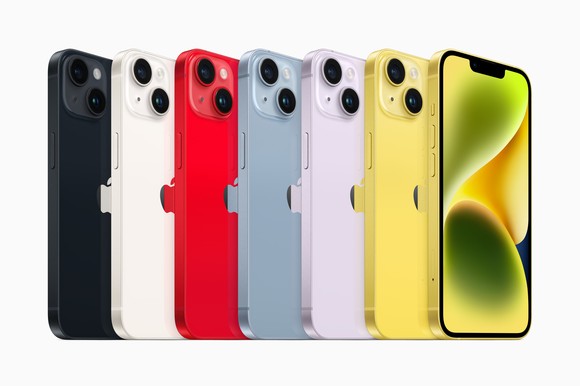 A lineup of iPhone 14s in different colors.