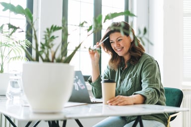 A person sitting at their desk.