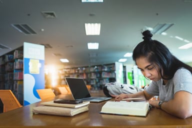 economics student studying in the library