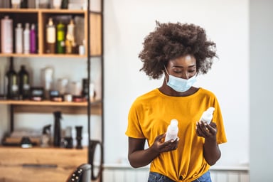 examining some beauty products in a salon